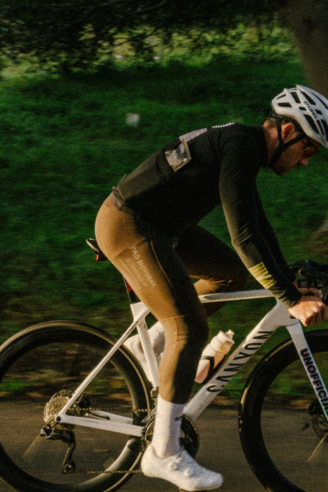 Cyclist riding through Centennial Park, panned motion
