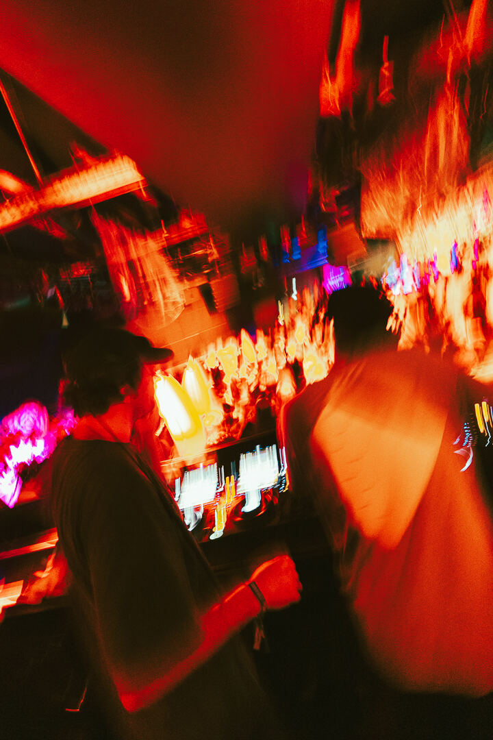 Blurred bar scene in red neon light